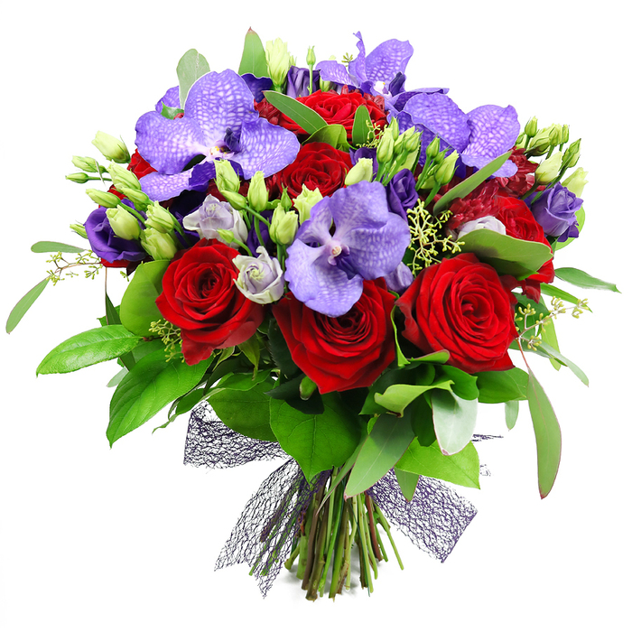 On a bright white studio backdrop, this lush bouquet is a testament to meticulous floristry practised near Brent Cross. The round, generous arrangement places deep red roses at heart, their velvety petals spiraling inward in a classic symbol of romance and devotion. Surrounded by purple Vanda orchids, which spread their broad petals with a subtle speckle pattern, the bouquet exudes an exotic, upscale vibe. Interspersed among the roses and orchids are clusters of lisianthus in soft purple tones, some buds closed, others just opening, offering a sense of anticipation and renewal. The greenery is abundant and varied: large glossy leaves provide a bold contrast to the rich florals, while slender sprigs of filler foliage and small buds add texture and movement. The entire structure is tied at the base with a dark, mesh ribbon that creates a modern, almost architectural finish, allowing the stems to show through and giving the bouquet an airy silhouette. This design speaks to celebration-weddings, anniversaries, or a statement gift for a special birthday-and it looks equally at home in a stylish Brent Cross dining room or on a hotel suite table in nearby Cricklewood. The visual balance pairs romance with contemporary elegance, and the scent of rose and orchid lingers softly, complemented by fresh greenery. For customers in the Brent Cross area, this arrangement is available with careful handling and reliable delivery across NW4, ensuring the same-day option remains a practical, comforting choice for heartfelt moments. Crafted by a seasoned local florist, it reflects a refined taste and a deep understanding of what makes a bouquet truly memorable.