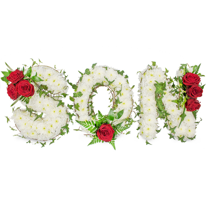 A striking memorial composition spells out 'SON' in three substantial capital letters, each letter constructed from a dense, carpet-like layer of small white spray chrysanthemums whose clustered petals create a smooth, almost cushion-like surface. The white is pure and quiet against the studio's bright white background, giving the piece a dignified presence that reads clearly in photos and at services. Lush ivy vines are artfully threaded through the chrysanthemums, their rounded leaves and trailing stems adding depth and a living, evergreen quality that suggests continuity and remembrance. Accenting the design are groups of deep red roses placed to balance and emphasise the sentiment: three roses sit tucked into the top-left curve of the 'S', a single prominent rose rests at the base of the 'O' accompanied by soft fern fronds, and three more roses are arranged vertically along the right-hand stroke of the 'N'. These concentrated flashes of crimson provide a visual focal point and convey passionate love against the calm white base. The arrangement carries a soft, respectful fragrance - the faint, clean scent of chrysanthemum layered with the richer perfume of roses - and is finished with glossy dark-green foliage for contrast. This kind of personalised letter tribute is commonly chosen for funeral services, graveside placements or memorial pieces at nearby venues such as Golders Green crematorium or local parish churches, and it expresses tenderness, honour and lasting remembrance for a son in a manner both tasteful and heartfelt.