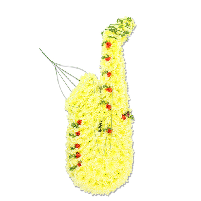 Against a stark white backdrop, a full-sized saxophone fashioned entirely from flowers commands attention with its bold colour and intricate craftsmanship. The body of the saxophone is coated in a thick, uniform layer of small bright yellow chrysanthemum florets, so tightly packed that they form a perfectly continuous surface, following every contour and curve. The gentle bend of the neck, the elongated body, and the flared bell are all clearly defined by this golden blanket of petals, which catch the light and lend the piece a radiant glow. Positioned at intervals along the instrument's length, clusters of tiny red rosebuds and miniature spray roses represent the saxophone's keys, their rich, velvety tones providing striking punctuation against the yellow. Intertwined through the design, delicate trails of dark green foliage and slender strands of bear grass trace natural lines along the edges, adding depth and suggesting the flow of music, as if a familiar tune were floating over Brent Cross, perhaps recalling evenings in local halls or community centres. Subtle glimpses of silver or green wire appear near the upper area, where the mouthpiece would be, as well as along certain joints, revealing the careful structural work that keeps this floral sculpture upright. Created by experienced florists at Brent Cross Flowers, this tribute feels particularly suited to a funeral, wake, or memorial for someone with a passion for jazz, brass bands, or live performance. The yellow chrysanthemums convey warmth, joy, and treasured memories, while the red roses speak quietly of love, devotion, and respect, making the arrangement a moving and memorable salute to a life lived to the rhythm of music.