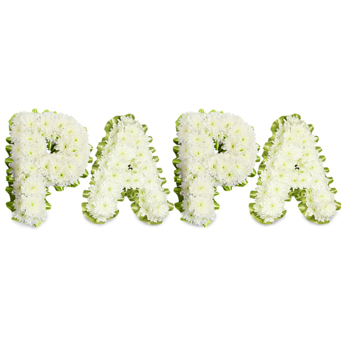 An elegant, heartfelt memorial piece that spells out PAPA in large, uppercase letters against a pristine white backdrop. Each letter is constructed from dense clusters of small, pure-white chrysanthemums or similar spray blooms, their layered petals giving the characters a soft, textured surface and a slightly rounded profile. Along the perimeter of every letter a pale green pleated ribbon or a thin rim of fresh foliage has been applied with careful pleating, the wavy border offering a fresh, understated accent that both frames and separates each letter with clarity. The flowers are set close together so that from a few paces the letters read as solid forms, while close inspection reveals the individual blossoms and the artisan hand that placed them.
The mood is one of solemn tenderness: the choice of white flowers suggests purity and serene farewell, while the green edging hints at renewal and gentle hope. Soft, diffused lighting removes hard shadows and allows the chrysanthemum textures to show in quiet detail, creating an image that is respectful and composed. A florist familiar with ceremonies around Brent Cross and nearby Hendon would choose this composition for a father or grandfather whose family wants a personal, familiar word - PAPA - to appear at a service, remembering him with dignity and intimacy. This arrangement demonstrates technical skill, emotional sensitivity and a local florist's understanding of how floral lettering can comfort mourners and honour a life.