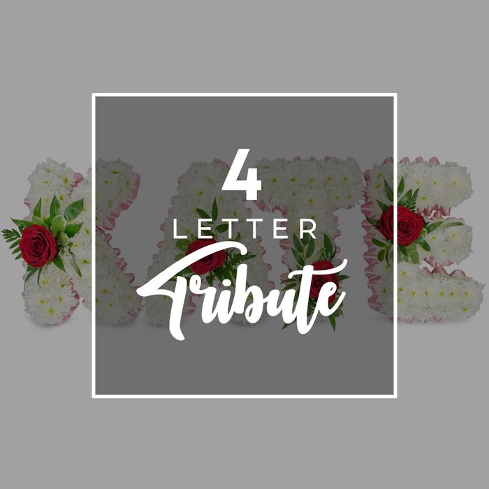 The photograph offers a refined look at a bespoke four-letter funeral tribute, styled with calm restraint and the kind of craftsmanship often sought by families in Brent Cross when words of farewell feel hard to find. In the middle of the frame, a dark grey square with softened transparency sits like a quiet overlay atop the floral work, its edges neatly traced with a slim white border. On this overlay, white lettering delivers a clear message: a large, confident 4 at the top, the word LETTER parked beneath in a modest, modern typeface, and the word Tribute sweeping across the bottom in a flowing script that introduces a hint of gentle movement. Beneath this central graphic, four substantial floral letters stretch out horizontally, their forms extending beyond the square so that the shaping of a name such as KATE can be read. Each letter is clad in a thick carpet of white chrysanthemums, the blossoms packed shoulder to shoulder to create a soft, textured surface that conveys purity and tranquillity, qualities many associate with sympathy flowers. Along the outer sides, a fine edging of pale pink ribbon or fabric is visible between the blooms, providing a subtle outline that feels tender and personal. Dotted thoughtfully across each letter, deep red roses provide striking accents; their luxurious, spiralling petals are complemented by tufts of glossy green foliage, which lend depth and a natural, garden-like touch. The surrounding background is a smooth light grey, deliberately understated so all attention rests on the tribute. Altogether, the image demonstrates how local florists in Brent Cross can craft meaningful funeral letter tributes, personalised names, and short words in flowers to honour someone dear at a final service, crematorium farewell, or quiet remembrance near the shopping centre and nearby residential avenues.