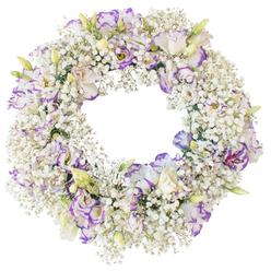 The image shows a beautifully balanced funeral wreath set against a stark white background, where every petal and floret is visible in fine detail. Forming the structure of the wreath is a lush ring of baby's breath, the countless white Gypsophila blooms packed closely enough to create an almost velvety surface. This snowy base curves evenly around a clear central opening, making the circle feel complete and harmonious. Rising gently from the baby's breath are clusters of lisianthus, their blooms like small, ruffled cups of china. Each lisianthus is primarily white, but the petals are traced with shades of lavender, lilac, and violet at their outer edges, giving a delicate wash of colour that ripples through the design without disturbing its quiet mood. Some blossoms have opened fully, exposing inner layers of petals and slightly darker centres, while nearby buds remain closed, pale green and cream with a hint of purple at the tips. The composition is neat and symmetrical, with no additional foliage to distract from the interplay between fluffy Gypsophila and the more structured lisianthus heads. The feel is gentle, pure, and contemplative-well suited to a funeral or memorial service in and around Brent Cross, perhaps delivered to a family paying their respects near Hendon or Golders Green. The lighting is bright yet soft, highlighting the contrast between the cool purples and clean whites, and allowing the viewer to imagine the subtle, fresh scent of newly cut flowers. Overall, the wreath expresses sympathy and remembrance with understated elegance, offering comfort through its calm, enduring beauty.