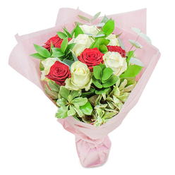 A thoughtfully arranged medley of deep red and creamy white roses creates an eye-catching bouquet, evocative of Brent Cross's vibrant yet welcoming spirit. The abundant blossoms are interwoven with glossy ruscus and silvery eucalyptus foliage, echoing the diverse natural beauty found in nearby Clitterhouse Playing Fields. Each rose stands at its freshest, petals tightly furled and radiant, resting in a harmonious dome shape that invites both touch and admiration. Delicate variegated leaves bring gentle contrast, and the entire hand-tied arrangement is enveloped in soft pastel pink paper that softly diffuses natural light, casting a calming glow fitting for celebratory mornings in North West London. This bouquet is neatly gathered and secured at the base, the wrapping hinting at romance and anticipation. Ideal for anniversaries, wedding celebrations, or as a surprise gesture to a loved one along Tilling Road, the bouquet's visual luxury and tender fragrance linger in the air. Every stem is selected by a skilled local florist, reflecting Brent Cross's tradition of heartfelt gifting and neighbourhood warmth. As you take in the artistry of the arrangement, there's a sense of occasion and gentle optimism present in every leafy fold and bloom.