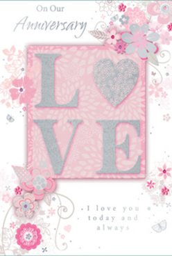 There is a composed, timeless elegance to this anniversary card, reminiscent of the careful balance a florist seeks when arranging roses and seasonal blooms for delivery across Brent Cross. The colour scheme is refined and soothing, dominated by pearly whites, gentle greys, and powder pinks that blend gracefully together. At the heart of the composition, the word "LOVE" is spelled out in raised, textured letters edged with soft glints of glitter. The surface of the letters catches and reflects the light with subtlety, akin to the way a silver ribbon shimmers around a bouquet presented along Hendon Way. This central motif rests on a blush-toned panel that seems to emit a quiet, romantic glow. Radiating from around the word are delicate illustrations of flowers and swirling vines, drawn with a light, flowing hand. Each bloom displays fine details: carefully defined petals, softly shaded centres, and occasional touches of silver foil that pick up the light like morning dew. The floral sprays curve and dance across the card, filling the space without overwhelming it, much like scattered petals artfully placed on a wedding table. The overall feel is light, airy, and gently celebratory. An elegantly scripted message accompanies the design, offering heartfelt wishes for enduring affection and shared memories. Together, these elements create a card that feels like a fragrant memory pressed between the pages of a beloved book-a keepsake that would pair beautifully with an anniversary arrangement from Brent Cross Flowers, ready to be delivered to homes and restaurants around the local area.
