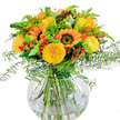 This cheerful bouquet brings the spirit of Brent Cross indoors, bursting with the golden light of sunflowers and lush garden roses artfully arranged in a modern, clear glass vase. The bold, sunny faces of the sunflowers seem to channel the vibrancy of bustling streets near Brent Cross Shopping Centre, while tightly packed yellow roses add softness and elegance through their intricate petals. Red hypericum berries are tucked between the blooms, injecting upbeat pops of colour that recall lively moments at local cafés and parks. Wispy ferns spill over the edges, lending a relaxed airy quality, as if caught on a breeze from Clitterhouse Fields, while slender spikes and sprays of yellow filler bring energy and dimension to the bouquet. Silver-blue eucalyptus leaves hint at cool freshness, balancing the warmth with subtle fragrance. Light catches on the water-filled vase, revealing the arrangement's green stems and reflecting the abundant brightness above. This bouquet's joyful composition makes it an uplifting addition for birthdays, anniversaries, or welcoming friends and family to your Brent Cross home-handcrafted by florists who delight in sharing a little extra happiness with NW4 neighbours.