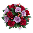 Soft lavender roses and deep, velvety red roses gather in a generous, dome-shaped hand-tied bouquet photographed from a slightly top-down angle against a clean white studio background. There are roughly ten to fifteen fully opened blooms, each rose petal spiralling outward in a perfect, plush curl; the lavender blooms hold a cool, powdery whisper of purple while the crimson flowers bring a satin, passionate glow. Nestled among the roses is a nest of glossy, dark green foliage-ruscus-like leaves that catch light with a smooth sheen and give the arrangement a structured, almost sculpted fullness. Scattered through the mass of petals are small, bright orange-red berries resembling rose hips; their joyful, jewel-like pops of colour introduce a wild-garden texture that balances the formal rose shapes and suggests an autumn-laced freshness. Near the bottom centre of the bouquet a small white card peeks out, handwritten with the single word flower in playful red script, a personal touch that reads like a whispered sentiment. The overall impression is intimate and composed, the scent imagined as a layered mix of velvet petals and cool green leaves-like a garden after a soft rain. Soft studio light creates subtle shadows between each bloom, accentuating petal folds and the depth of colour. This arrangement feels well suited to anniversaries, heartfelt apologies, or an intimate dinner setting where romance and quiet celebration are desired. As a local florist might say, it carries a balance of classic romance and contemporary elegance that makes it a thoughtful, tactile gift for someone you hold dear in the Brent Cross area.