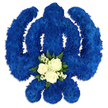 A powerful yet graceful Khanda floral tribute fills the scene, set against a simple white background that allows every petal to be appreciated. The sacred Sikh emblem-the vertical double-edged sword, encircled by the smooth band of the chakkar, and supported by two sweeping kirpans-is crafted entirely from small, densely packed royal blue chrysanthemums or similarly clustered flowers. Their compact blooms form a velvety, uniform surface, with the deep blue colour evoking dignity, loyalty, and spiritual reflection. Gentle highlights and shadows play across the petals, giving the symbol depth and a quiet sense of movement, as though it has been freshly placed by caring hands. At the lower central point of the design, within the curve of the blue, rests a delicate cluster of contrasting blooms. Three white roses, creamy and soft with partially open petals, are surrounded by tiny white filler flowers, likely baby's breath, and framed by lush dark green foliage. This simple yet refined grouping draws the eye inward, adding a note of purity, solace, and peaceful farewell. The clean background and soft shadow beneath the arrangement suggest it rests on a stand or table, ready to be displayed at a Sikh funeral or remembrance gathering. Created with care by Brent Cross Flowers for families across Brent Cross, Hendon, and Temple Fortune, this floral Khanda offers a deeply meaningful tribute, honouring both the spiritual symbolism of the emblem and the personal love shared with the departed.