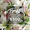 From Brent Cross Flowers, in the heart of Brent Cross, this lush close-up showcases a Florist Choice Bouquet priced at ?300. The arrangement explodes with premium blooms: pristine white roses in varying stages of bloom and elegant white lilies, their inner petals kissed with a soft pink tint. Intertwined among the main florals are delicate pink blossoms and generous clusters of leafy green foliage, likely eucalyptus, which lend texture, depth, and a gentle, fragrance-friendly backdrop. The bouquet fills the frame with a warm, opulent radiance, as if just gathered from our studio and carried into the light. A white rectangular overlay sits at the center, framed by a slim border, bearing the brand cues in tasteful contrast: Florist in a flowing script, CHOICE BOUQUET in a crisp sans-serif, followed by the expression ? BOUQUET ? and the bold numeral ?300 in white. This image communicates a high-end, professionally curated arrangement designed for gift-giving on anniversaries, milestone celebrations, or heartfelt gestures. The scent is imagined as fresh and airy, the textures ranging from satin rose petals to the velvety lilies, inviting touch and memory. In Brent Cross, Brent Cross Flowers offers reliable same-day delivery to nearby streets and neighbourhoods, so loved ones in Cricklewood, Golders Green, and Hendon feel the care that accompanies every stem. It's a statement of refinement, crafted to brighten a room and lift the spirit with quiet luxury.
