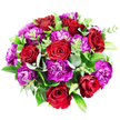 Captured from directly above on a clean white backdrop, this bouquet forms a perfect circle of rich colour and texture, composed of red roses, purple carnations, and layered greenery. At its heart, approximately seven or eight red roses create a focal cluster, each bloom showing velvety petals that spiral from tight centres into gently opening, layered forms. The roses carry subtle variations in tone, with bright, passionate scarlet on the outermost petals and deeper, almost burgundy hues nestled in the inner folds, lending the arrangement a sense of depth and emotion. Encircling and mingling between the roses, carnations in vivid magenta and deep purple create a soft, ruffled halo. Their serrated petals gather into dense, cushion-like heads, some glowing in fuchsia, others leaning to plum and royal purple, bringing energy and contrast to the smoother rose petals. The greenery, carefully threaded through the blooms, includes rounded eucalyptus leaves with a soft, silvery-green cast, plus broader, darker green leaves that shine gently and frame the flowers. Slim stems of smaller, bright green leaves peek out at different angles, adding freshness and a natural, garden-like feel-as if the bouquet had been gathered from a border near Brent Cross Park on a clear morning. The arrangement is tightly packed and impeccably rounded, with no visible stems from this top view, just an uninterrupted surface of petals and leaves. The mood is celebratory yet intimate, making this design perfect for romantic gestures, birthdays, or thank-you gifts delivered to homes and businesses around Brent Cross by local florists who understand the character and pace of NW London life.
