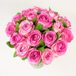 A generous, hand-gathered bouquet of roughly two dozen fresh pink roses sits in a simple clear glass vase against a clean, evenly lit white background. Each bloom is fully or nearly fully open, the petals layered like silk from a deep fuchsia at some hearts to soft blush and pale rose on the outer petals, creating a gentle ombre that gives the cluster depth and movement. Dark green leaves are tucked throughout, their glossy texture and cooling tone framing the warm pinks and heightening the sense of freshness. The photograph is taken from a slightly elevated, overhead angle so the rounded, tightly packed dome of flowers reads abundant and inviting; the rim of the vase is barely visible at the bottom edge, anchoring the composition without distracting from the blooms. Soft, diffuse light washes over the arrangement, picking out velvety petal edges and the subtle scent you imagine rising from the bouquet - faintly powdery, sweet, and unmistakably rose. There is a classical, celebratory air to the design: romantic and reassuring, it suits anniversaries, Mother's Day, birthday tributes, or simply bringing a sense of warmth to a room. As a local florist's vision rooted in Brent Cross, the bouquet reflects the neighbourhood's quiet, well-tended charm - the kind of floral gift someone might carry home after a quick stop near Brent Cross Shopping Centre or deliver to a friend in nearby Hendon. The overall feeling is one of thoughtful abundance: soft colour, tactile richness, and approachable elegance captured in luminous white light.