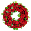 Within Brent Cross Flowers' studio, a deeply symbolic circular wreath sits against a clean white backdrop. Dozens of vibrant, deep red roses form a dense ring, their velvet petals layered in a way that invites the eye to travel from bud to bloom. The roses range from tightly furled buds to softly opened faces that catch the studio light and glow with warmth. The colour range runs from every shade of ruby to burgundy, a living spectrum that seems to inhale and exhale with the viewer's gaze. Intertwined among the roses are sprigs of fresh green foliage, broad matte eucalyptus-like leaves that soften the edge of the red tide, and slender glossy ruscus that provide a crisp architectural heartbeat to the arrangement. The textures are rich and tactile, the satin sheen of each petal, the springy resilience of the stems, the gentle rustle of the foliage as a breeze might brush through a window. The wreath is a circle without seam, a universal symbol of remembrance and continuity, rendered here with refined opulence that never overwhelms. Light falls softly from above, casting delicate highlights across overlapping petals and turning the greens into a velvet frame for the crimson core. This piece communicates sympathy, honor, and enduring connection, making it a natural choice for funerals, memorial services, or anniversaries of remembrance in Brent Cross and nearby communities. For those writing about floral tributes or memorial displays, this wreath offers a clear, tangible example of traditional symbolism-red roses for love and remembrance, green foliage for growth and renewal-beautifully realized by a local florist with decades of experience in the area.