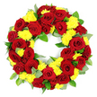 A full, circular funeral wreath fills the frame against a pristine white background, creating a striking contrast that draws the eye to its ring of red and yellow flowers. The wreath is crafted with meticulous care, the flowers placed so closely together that they form a thick, continuous band with a clear, open centre symbolising the cycle of life and memory. Deep red roses feature prominently, their lush, velvety petals unfurling in generous spirals. Some blooms appear a brighter, classic red, while others show hints of darker burgundy, giving the circle a subtle, rhythmic variation in tone. Nestled between these roses are clusters of yellow chrysanthemums, their many fine petals creating rounded, fluffy heads that soften the overall look. The yellow blooms shine like small pockets of sunlight, offering a sense of comfort and gentleness that could feel especially fitting at a memorial gathering or funeral service around Brent Cross and the nearby communities. A mix of greenery supports and frames the flowers. There are strong, dark green leaves with a slight sheen, likely forming the main structural base, and interspersed among them are lighter, almost silvery-green sprigs reminiscent of eucalyptus, which add delicate texture and cool contrast. The foliage extends just beyond the flower line, softening the wreath's edges while keeping its circular form clearly defined. The lighting is bright and evenly distributed, eliminating harsh shadows and allowing the colours and textures to stand out clearly. Overall, the wreath conveys a sense of balance, care, and quiet beauty, an elegant floral tribute suitable for laying at a coffin, resting by a graveside, or standing beside a framed photograph during a farewell service in Brent Cross.