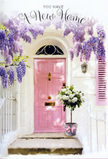 This doorway scene, imagined in a quiet corner of Brent Cross, reveals a pastel world where flowers carry the emotion of moving into a new home. At the centre is a graceful pink front door, its finish smooth and softly matte, catching a gentle fall of natural light that makes the colour appear warm and inviting. The walls surrounding it are whitewashed, subtly textured, and slightly weathered, their pale tones reflecting brightness back into the entrance. A simple shutter, painted in a coordinated hue, sits to one side, adding balance to the composition. Above the door, wisteria cascades in lavish curtains, each stem bending into delicate clusters of lavender blooms. The blossoms hang at various lengths, creating layers of colour and shadow that suggest a fragrant canopy, not unlike the flowering vines you might notice in the gardens tucked behind homes off Brent Cross's residential roads. On the step below, a grey bucket stands as a charming, unfussy vessel for a lush arrangement of white and cream roses. The flowers are tightly massed, their petals velvety and slightly ruffled, folding into one another in a soft, cloud-like effect. Wisps of green foliage peek out here and there, adding slender lines of contrast and a feeling of freshness, as if the bouquet has just been delivered by Brent Cross Flowers to celebrate a new set of keys. The bucket is finished with a pink ribbon tied carefully around its base, the bow's tails draping lightly over the metal. The lighting is calm and hopeful, casting gentle shadows and illuminating each petal. Together, the wisteria, roses, and sunlit doorway create an atmosphere of tender celebration, perfect for marking the start of a new life in Brent Cross with understated beauty and sincere warmth.