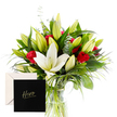 From the shop window of a Brent Cross florist, this arrangement reads like a garden distilled for a vase. The white lilies anchor the center, their trumpet-shaped blooms luminous and airy, while red roses weave through the bouquet with confident, romantic presence. A lattice of green fan and woven foliage creates a lively lattice - sharp, glossy leaves that catch the light and cradle each stem with quiet strength. The contrast between the pure white and the deep crimson feels bold yet graceful, a gesture of courage tempered by tenderness. Wrapped in a simple, elegant wrap, the bouquet carries a message of appreciation and heroism: you are extraordinary; you are valued. A Hero card is tucked among the stems, making it perfect for heartfelt acknowledgment, a personal salute to someone who has risen to meet a challenge. In person, the arrangement exudes fresh, clean fragrance - the lilies offering a gentle spice, the roses adding a classic sweetness that lingers in the room. The lily buds hint at what's to come, promising continued beauty as the blooms unfold. The overall presentation is bright and uplifting, suited to brighten a desk, a mantel, or a hospital tray with a touch of refined glamour. This design is photographed in soft natural light, allowing every texture - the silk-like petals, the gloss of the leaves, the crisp stems - to come forward. Our local Brent Cross florist offers same-day delivery across Brent Cross, Golders Green, Hendon, and Cricklewood, bringing this elegant tribute to doorsteps throughout NW4 and beyond.